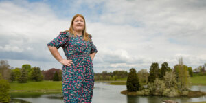 Hannah stood in front of lake island.