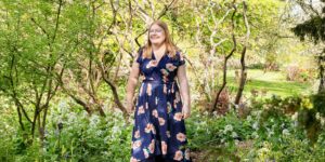 Hannah walking along garden path.