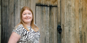 Hannah stood near old wooden door.