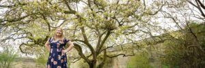 Hannah in front of magnolia tree