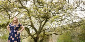 Hannah in front of magnolia tree