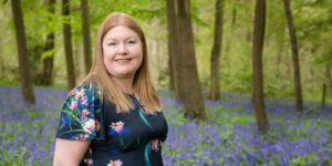 Close up of Hannah in bluebell woods.