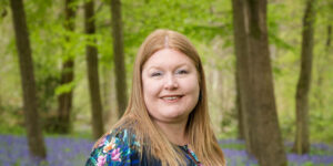 Close up of Hannah in bluebell woods.