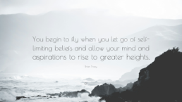 Waves crashing into cliffs with quote: You begin to fly when you let go of self-limiting beliefs and allow your mind and aspirations to rise to greater heights - Brian Tracy