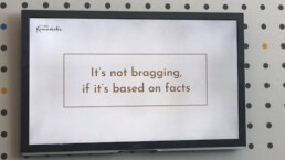 A quote on a TV screen reading It's not bragging, if it's based on facts.